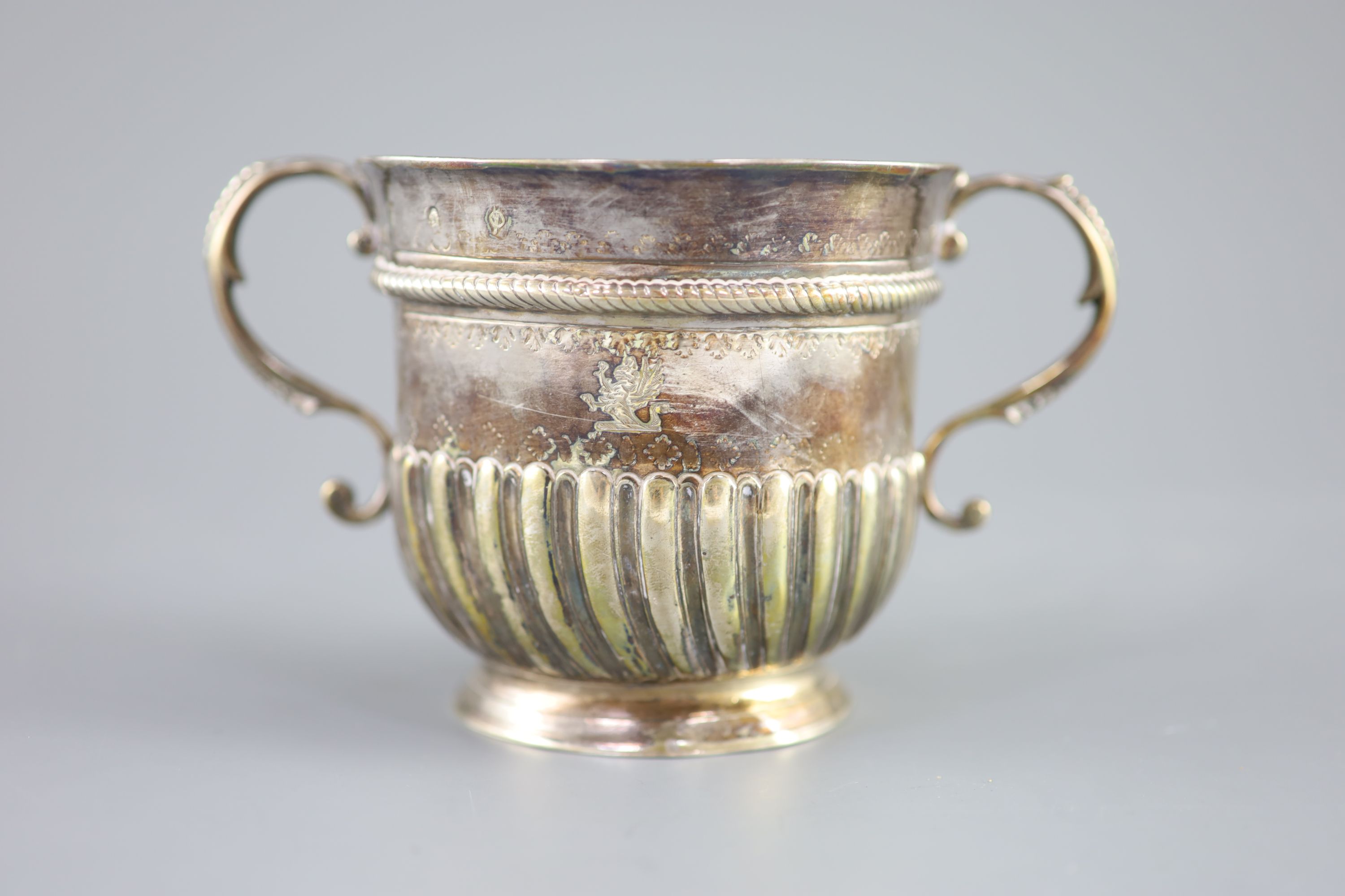 A Queen Anne demi-spiral fluted silver porringer